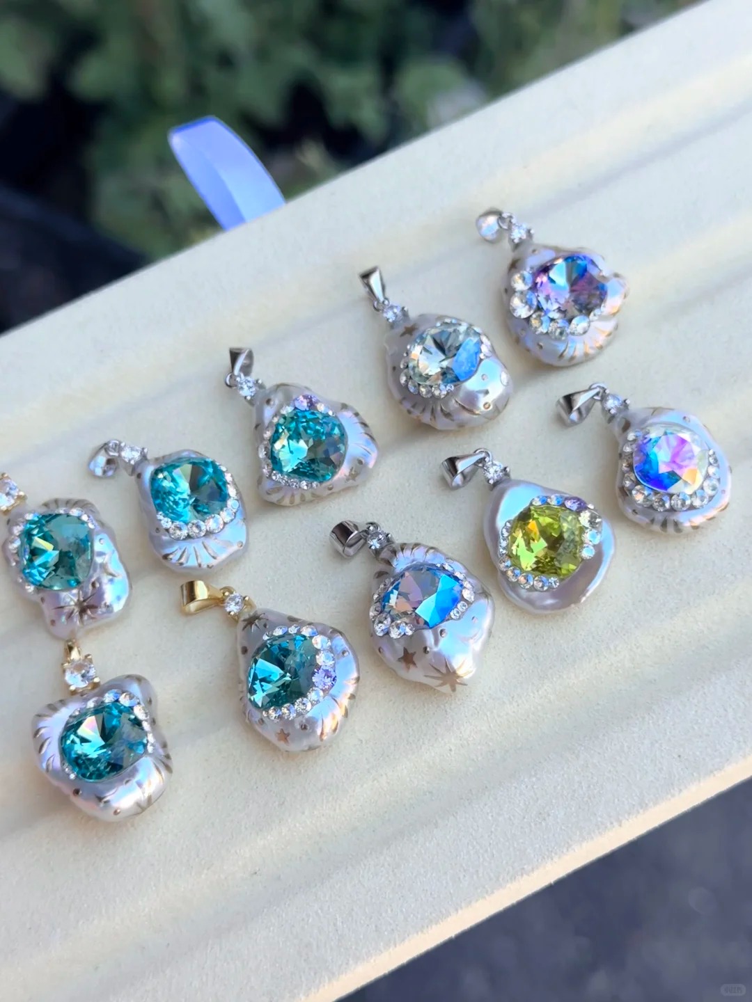 Colourful pearl pendants sparkling in sunlight